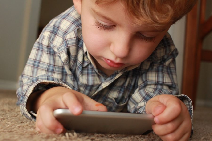 Young boy on telemedicine visit via smartphone