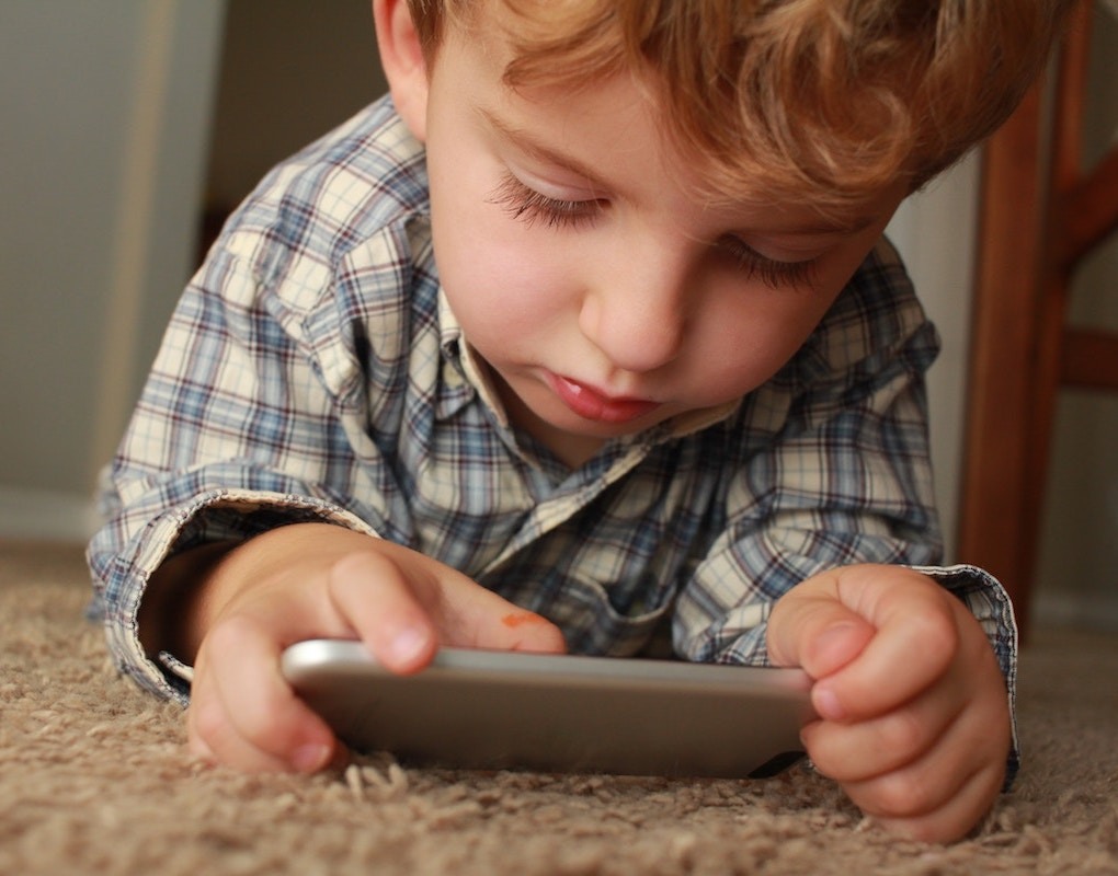 Young boy on telemedicine visit via smartphone