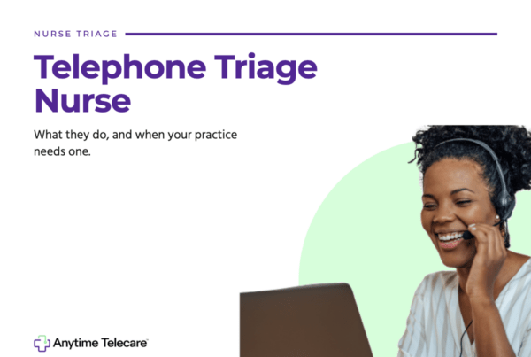 Telephone triage nurse wearing a headset assisting a patient by phone at a laptop
